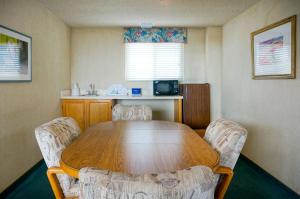 a dining room with a table and two chairs at Cabrillo Inn at the Beach in Santa Barbara