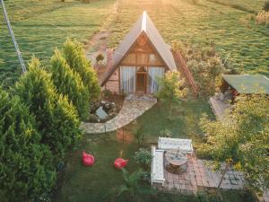 an aerial view of a small house in a field at Tenora in Rize