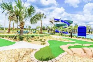 a miniature golf course at a resort with a slide at Storey Lake Resort, Private Pool, Near Famous Attractions!! in Kissimmee