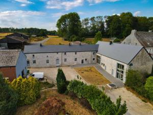 an aerial view of a large white building at La ferme du Comte in Durbuy
