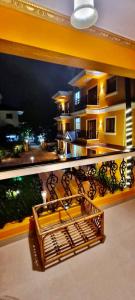a view of a balcony of a house at night at Casa de Laura in Calangute