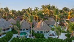 an aerial view of a resort with palm trees at Maya Tulum By G Hotels in Tulum