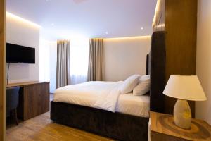 Postel nebo postele na pokoji v ubytování Hotel Castello