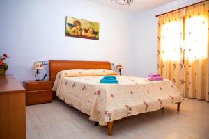 a bedroom with a bed with a table and a window at 039 Casa Marimar ETV8486 by Mallorca Charme in Muro +29 photos