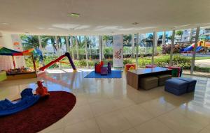 a childrens play area with a slide and a playground at Nautilus Home Club - Penha - SC in Penha
