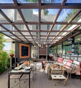 a restaurant with tables and chairs and a large glass ceiling at Marbella Boutique Art suites in Marbella