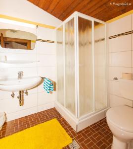 a bathroom with a shower and a sink at Pension Montana in Wagrain