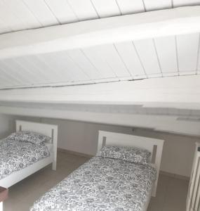 Postel nebo postele na pokoji v ubytování La Morice