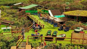 an aerial view of a garden with tables and chairs at Grajagan Surf Resort in Ilha do Mel