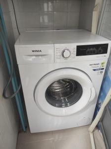 a white washing machine in a bathroom with at Apartamento en Viladecans cerca del aeropuerto in Viladecáns