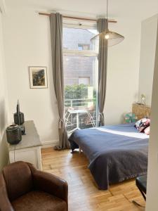 Posteľ alebo postele v izbe v ubytovaní Ravissant loft avec parking souterrain gratuit sur place + 3 fotografie