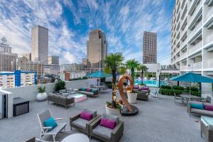 a rooftop patio with furniture and a slide at Holiday Inn New Orleans-Downtown Superdome, an IHG Hotel in New Orleans