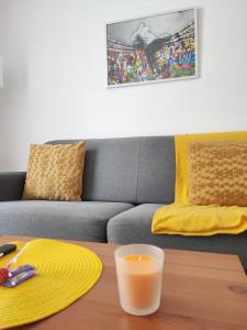 a living room with a couch and a table at *Street Clichy Art* - Appartement à 200 m de Paris ! in Clichy