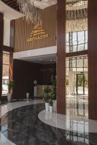 a lobby with a chandelier in a building at ARCHAZOR Mountain Resort in Chimgan