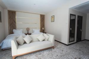 Кровать или кровати в номере ARCHAZOR Mountain Resort