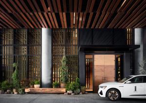 a white car parked in front of a building at 1 Hotel Nashville in Nashville