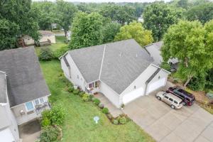 an aerial view of a house with a truck parked in the driveway at Beautiful Townhome, 11 minutes to Downtown, KCMO. in Kansas City