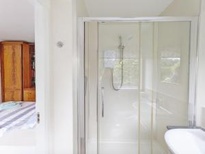 a shower with a glass door in a bathroom at Still Waters, Emsworth in Emsworth