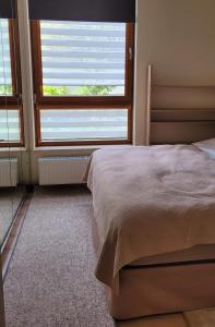 Posteľ alebo postele v izbe v ubytovaní Comfort Warszawa