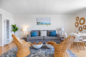 a living room with a couch and chairs at San Clemente Shores in San Clemente