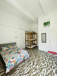 Postel nebo postele na pokoji v ubytování Hostal Badillo SV