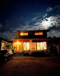 a small house with lights on in front of it at CANOA GUEST HOUSE A room - Vacation STAY 50937v in Ikeda