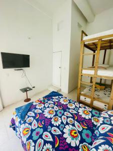 Postel nebo postele na pokoji v ubytování Hostal Badillo SV