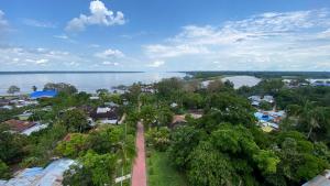 an aerial view of a town with a body of water at Maiku Amazonas in Puerto Nariño