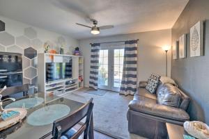 a living room with a couch and a glass table at 4 Mi to Beach Lake Havasu Apartment with Pool! in Lake Havasu City