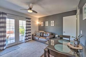 a living room with a couch and a glass table at 4 Mi to Beach Lake Havasu Apartment with Pool! in Lake Havasu City