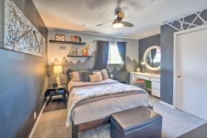 a bedroom with a bed and a table and a sink at 4 Mi to Beach Lake Havasu Apartment with Pool! in Lake Havasu City