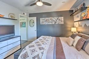 a bedroom with a bed and a flat screen tv at 4 Mi to Beach Lake Havasu Apartment with Pool! in Lake Havasu City +19 photos