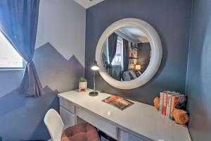 a room with a mirror and a desk with a mirror at 4 Mi to Beach Lake Havasu Apartment with Pool! in Lake Havasu City