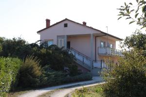 a house on the side of a hill at Apartments with a parking space Valbandon, Fazana - 7215 in Štinjan