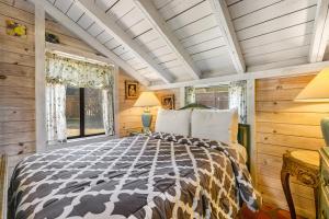 a bedroom with a bed and a window at Mendocino Dunes - Dune Flower in Fort Bragg