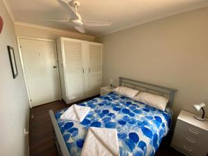 a bedroom with a bed and a ceiling fan at Tre Sorelle in Jurien Bay +9 photos
