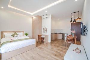 Katil atau katil-katil dalam bilik di Maris Da Nang Hotel & Apartment