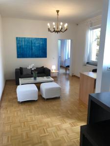 a living room with a couch and a table at studio e - Quiet central business one bedroom apartment for 3 guests in Düsseldorf