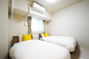 Katil atau katil-katil dalam bilik di Branchera Naha 1003 +60 gambar