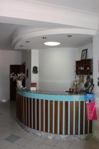 a lobby with a striped counter in a room at Hotel Royal in Coccorino +37 photos