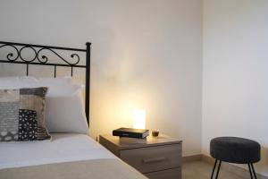 Villa Demarino tesisinde bir odada yatak veya yataklar