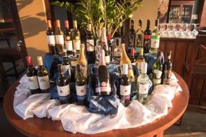 a bunch of bottles of wine on a table at Camellia Resort and Spa in Sigiriya