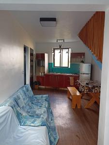 a living room with a couch and a table at R-Villa in Grand Baie