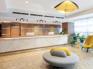 a waiting area of a hospital with a waiting room at Brady Apartment Hotel Flinders Street in Melbourne