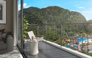 a balcony with a view of a mountain at Sunway Onsen Hospitality Suites in Ipoh