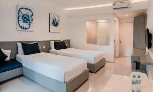 Postel nebo postele na pokoji v ubytování The Rooms Apartment Bali by ARM Hospitality
