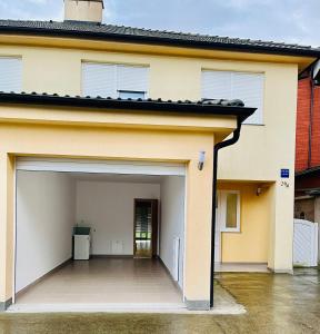 an open garage door of a house at ALOM in Osijek