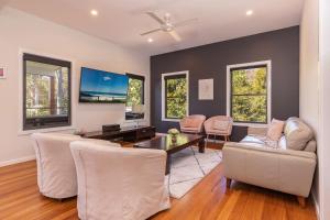 a living room with a couch and a table at Seaclusion in Elizabeth Beach