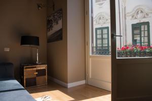 Televízia a/alebo spoločenská miestnosť v ubytovaní Gioeni Suites - Charming Loft