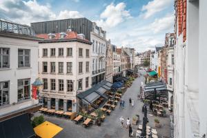 an overhead view of a city street with buildings at Tempel Cathedral Lodge in the Heart of Antwerp in Antwerp